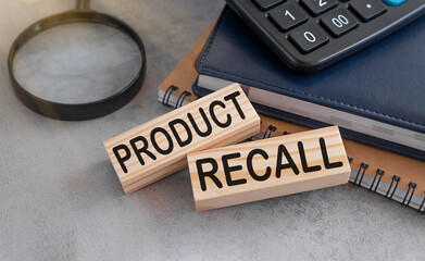 PRODUCT RECALL text on wooden cubes on white background