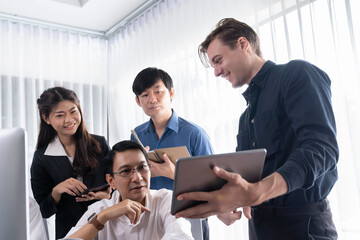 Obraz premium Group of diverse office worker employee working together on strategic business marketing planning in corporate office room. Positive teamwork in business workplace concept. Prudent