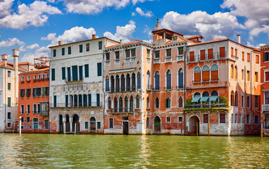 Fototapeta premium Venice, Italy. View at antique houses along the Grand Canal. Traditional italian Venetian architecture. From famous Realto Bridge