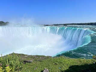 Horseshoe Falls at Niagara Falls on a Sunny Day with Mist Rising
