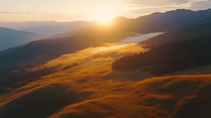 Fototapeta premium Golden Sunset Over Misty Mountain Ranges