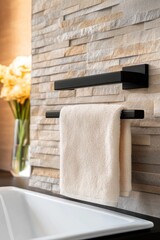 Stylish towel rail in a textured wall bathroom decor
