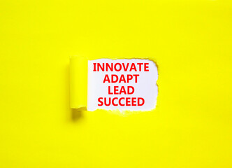 Innovate adapt lead succeed symbol. Concept words Innovate Adapt Lead Succeed on beautiful white paper. Beautiful yellow background. Business innovate adapt lead succeed concept. Copy space.