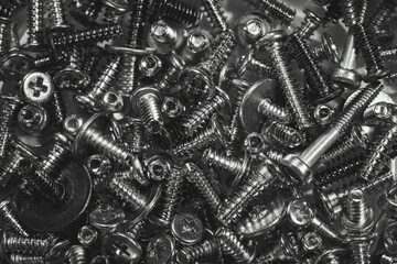 Mixed screws. Industrial background