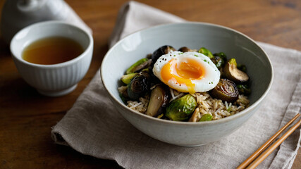 Warm Winter Rice Bowl. A deep ceramic bowl filled with fragrant jasmine rice, saut&eacute;ed mushrooms, and roasted Brussels sprouts