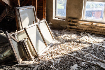 Obraz premium old glass and wooden window frames in attic