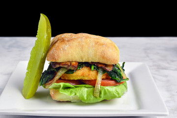 chicken   sandwich  top with onions, mushrooms and spinach