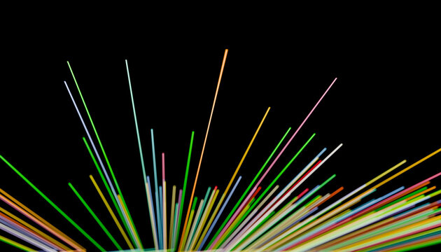Colorful fiber optic strands on black background
