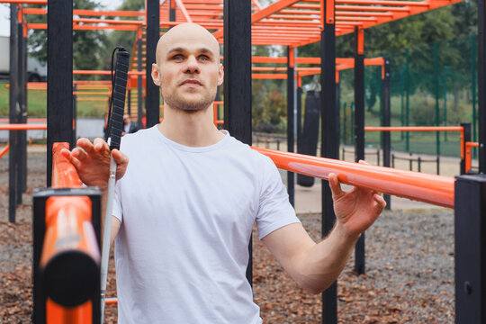 Blind blind man exploring outdoor fitness area with determination