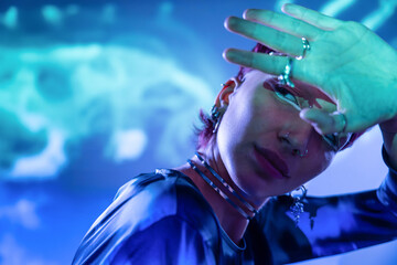 Futuristic woman in metaverse with neon lights
