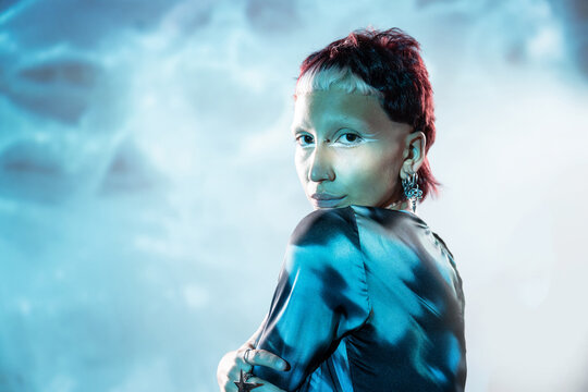 Futuristic woman in metaverse with creative makeup