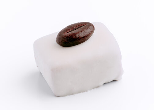 Elegant square petit four with coffee bean embellishment
