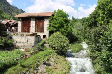Mountain stream and old house in the Vinschgau close to Glurns - Cycling the transalpine route Via Claudia Augusta