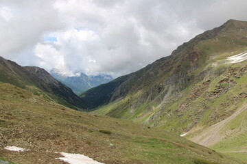  Umbrail mountain pass, Ortler Alps, view close from the peak of Stelvio - Cycling the transalpine route Via Claudia Augusta