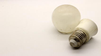 Broken white bulb isolated