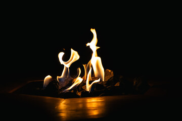 BURNING FIRE ON A DARK BACKGROUND