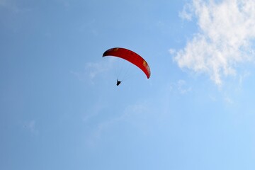 paragliding in the blue sky