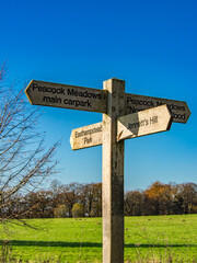Wooden sign post with blue sky and green grass Bracknell Berkshire