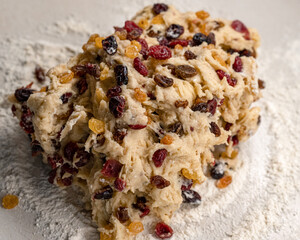 Dough for Christmas stollen with dried fruit on the table