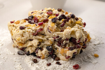 Dough for Christmas stollen with dried fruit on the table