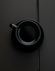 Black coffee cup on a dark wooden table quietly waiting for a drinker to enjoy its warmth