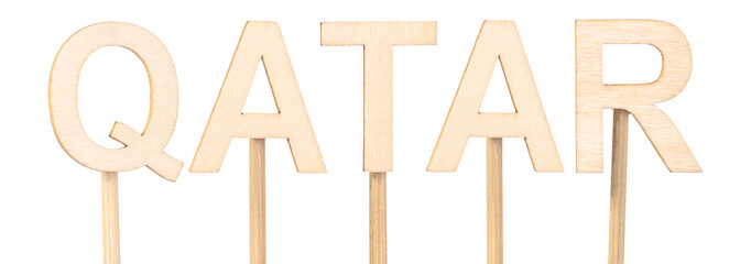 Wooden letters forming Qatar, ideal for craft projects. Countries of the world.