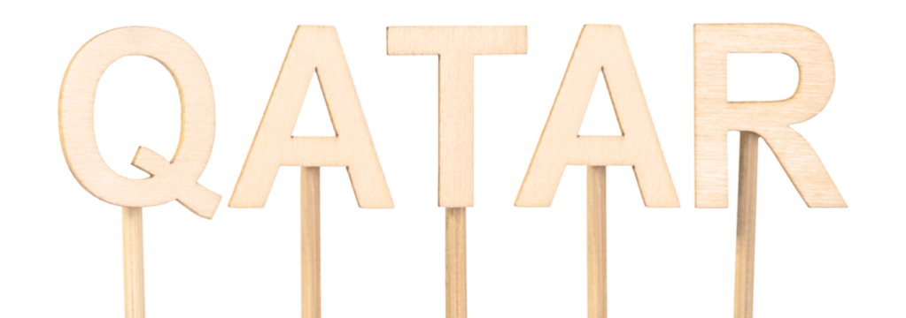Wooden letters forming Qatar, ideal for craft projects. Countries of the world.