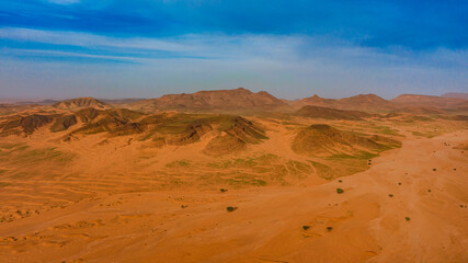 Moroccan Sahara Desert, ancient black volcanic mountains, the Sahara River Oued Ghris, stunning...