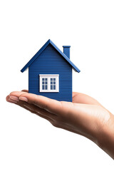 Blue house model held in hand symbolizes home ownership and real estate investment