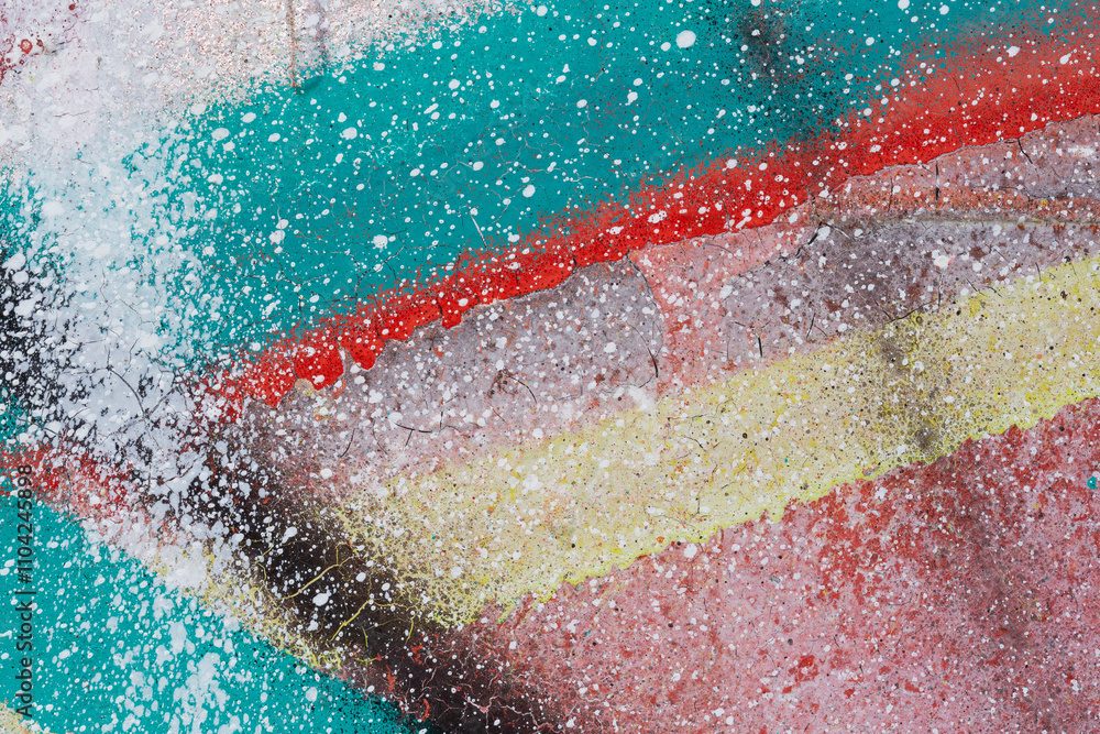 Poster macro close-up of a colorful spray painted wall spray with splashes. abstract full frame textured sp