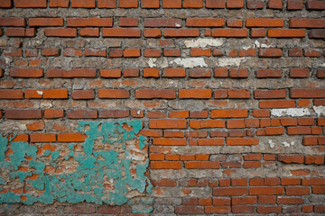 Weathered brick wall texture with peeling paint for a rustic background