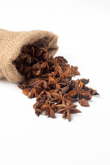 Detail of a bag of aniseed as you can buy it in the local shop on a white background