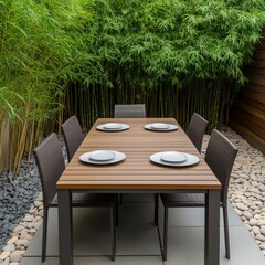 Fototapeta premium Tranquil outdoor dining area surrounded by bamboo plants and natural stones