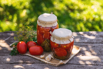 Preserving tomatoes in a jar. Selective focus.