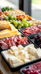 Cheese and charcuterie board with fruits and crackers prepared for a gathering
