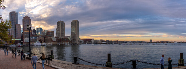 Large Panoramic View of the Boston Bay at Sunset with People walking around