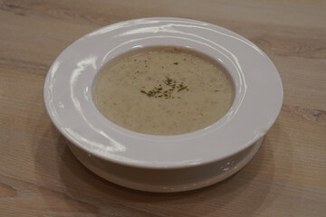 top view hot mushroom soup in a ceramic plate. on a ceramic plate. on wooden floor, food, object, decor, copy space