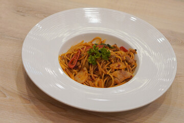 top view spicy spaghetti in a white ceramic plate on the wooden table background, food, nature, vegetable, object, decor, health, copy space