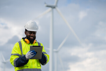 Service engineers checking system of windmill. Wind turbines generate electricity. Clean and Renewable energy concept.