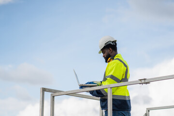 Service engineers checking system of windmill. Wind turbines generate electricity. Clean and Renewable energy concept.