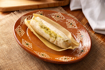 Tamales. hispanic dish typical of Mexico and some Latin American countries. Corn dough wrapped in...
