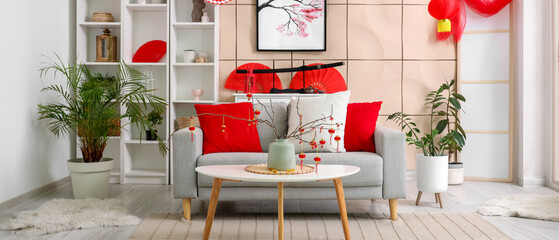 Interior of living room with sofa and decorations for Chinese New Year celebration