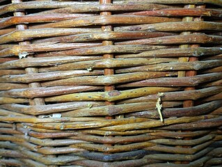 Background with weaving willow vine. Wall of a wooden basket. Texture of products from a vine. © Олег Струс
