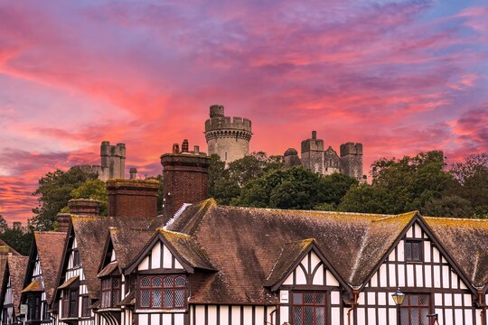 Arundel Castle was established in the 11th century. The castle was damaged in the English Civil War and then restored in the 18th and early 19th centuries.  Sunset sky.