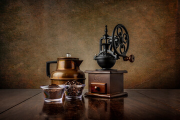 Reproduction Coffee Grinder with Bronze Coffee Pot with Ground and Whole Beans on a Walnut Table