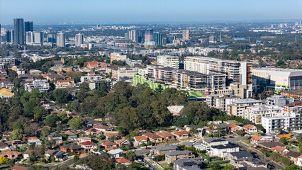 Naklejka premium Aerial drone view of Ryde in Northern Sydney NSW, Australia showing Top Ryde City in November 2024
