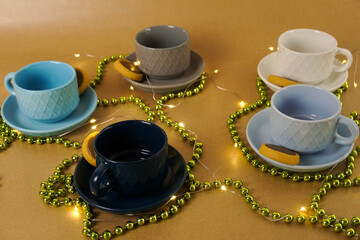 Colorful Cups with Cookies and Festive Lights.
