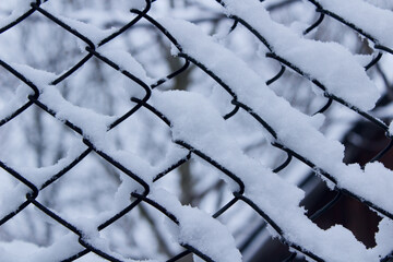 metal grid in snow  background