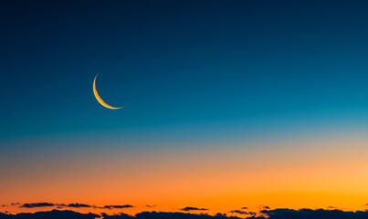 A serene image of a crescent moon hanging in a twilight sky