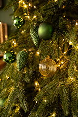 Christmas tree decorated with lights and balls. Bokeh
